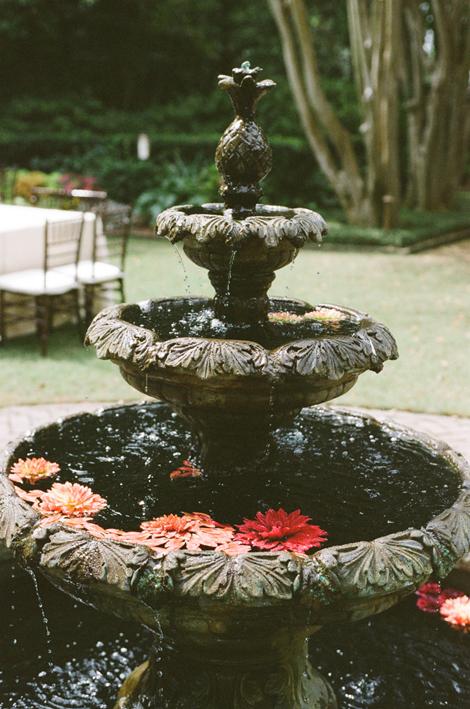 FLORAL WATERFALL: Various shades of pink blooms floated in the garden&#039;s fountain.