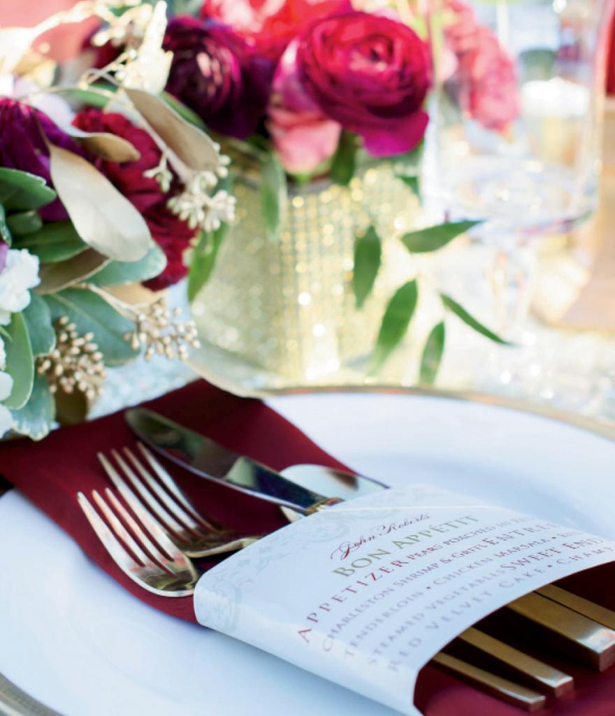 Menus by Signatures by Sarah. Flatware and charger from EventWorks. Napkins from Wildflower Linen. Florals by Larger Than Life Events. Image by Aneris Photography.