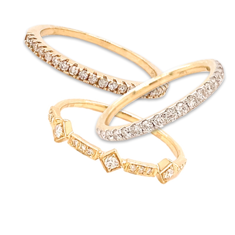 Stackable diamond rings in 14K yellow gold: geometric ($525); U-prong ($925) and classic ($575) from Gold Creations
